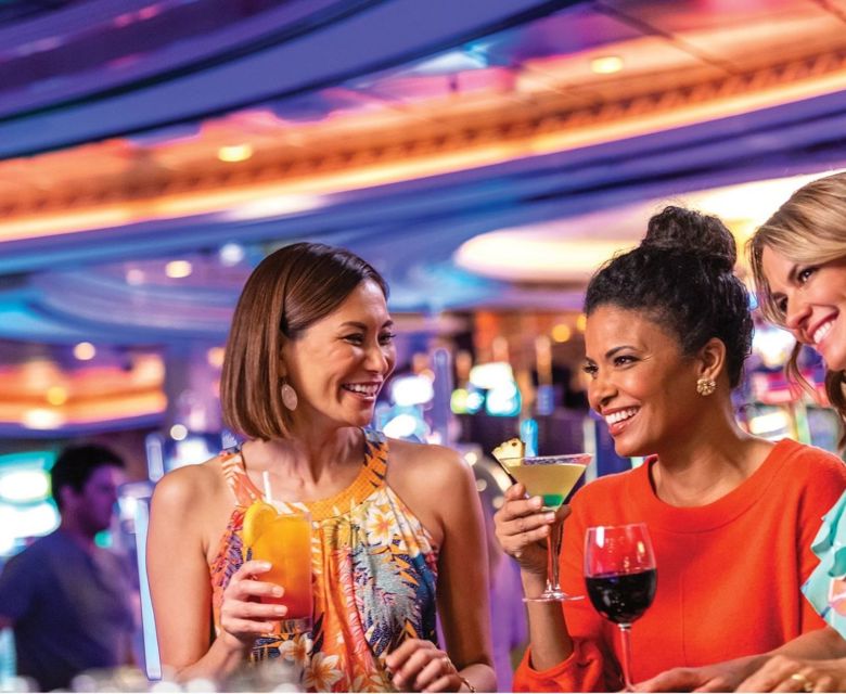  Three women having fun at cocktail bar