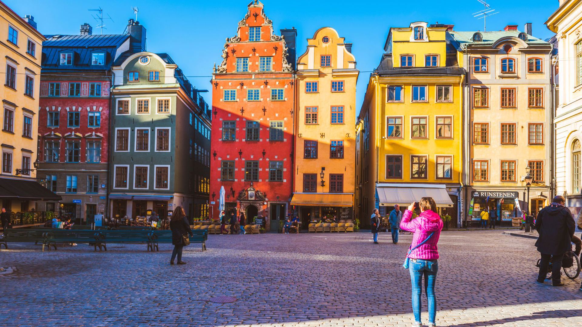 Traditional colourful houses in Stortorget Square, Stockholm - Credit: Getty Images