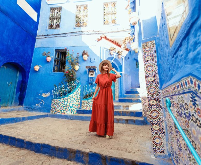 Woman surrounded by blue buildings