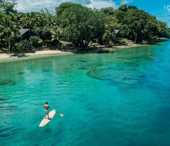 Person paddle boarding on Aore Island