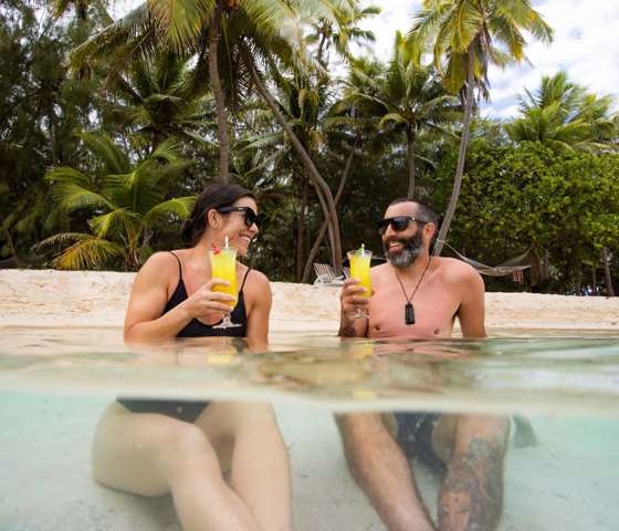 Tourists enjoying cocktails at the beach