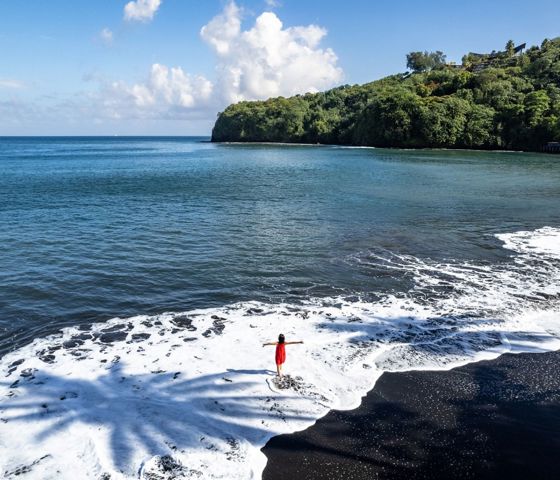 Women standing in the ocean