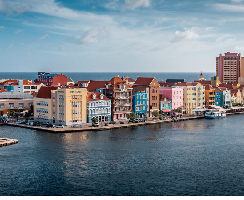 Pastel-coloured buildings and lively waterfront of Punda District - Willemstad, Curaçao