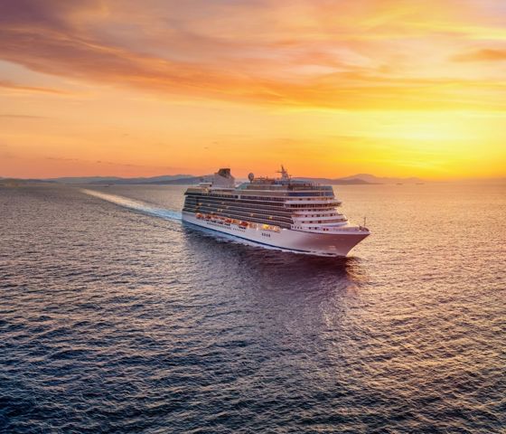 Cruise Ship At Sunset