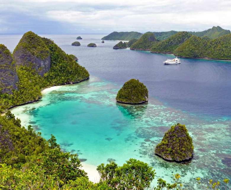 Coral Expeditions Raja Ampat Looking Out Over Wayag Lagoon From Mount Pindito 